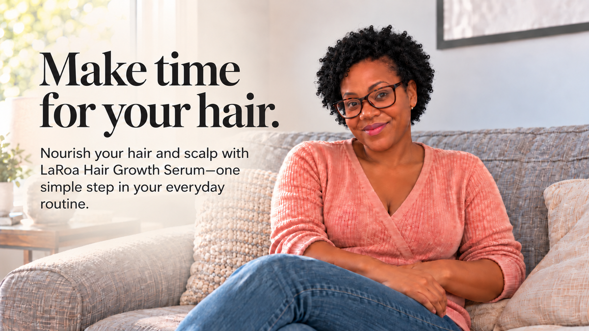 LaRoa founder with short black curls seated on a sofa beside Make time for your hair wording.